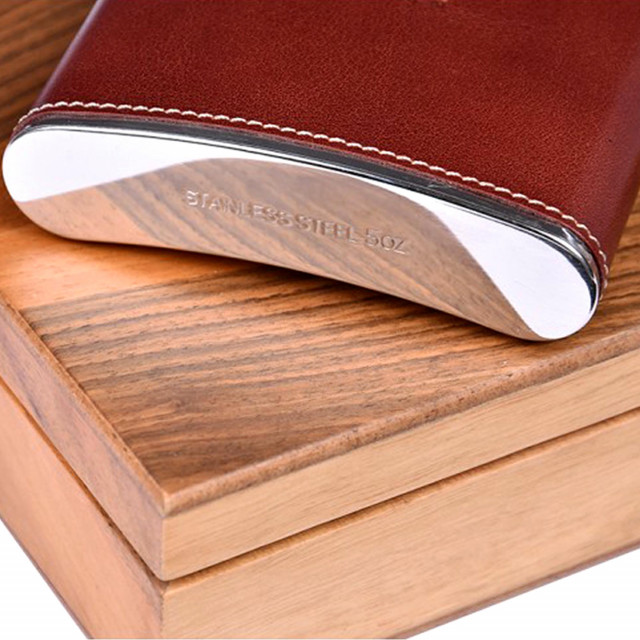 Stainless steel hip flask with brown natural leather